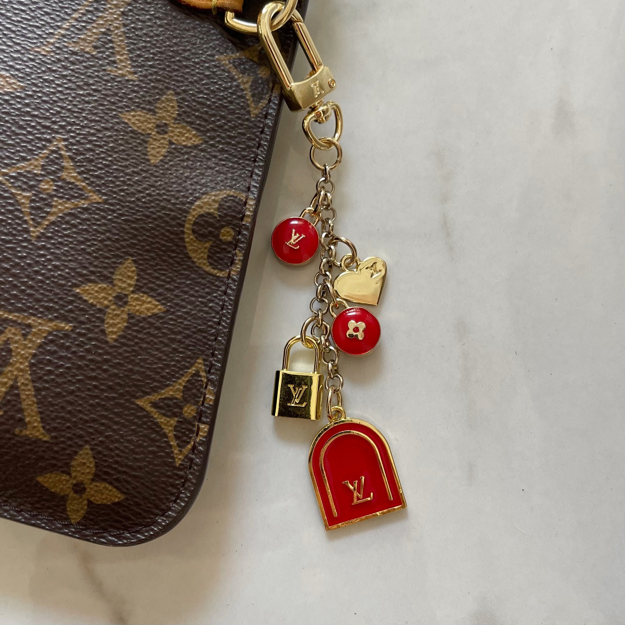 red louis vuitton bag with gold chain